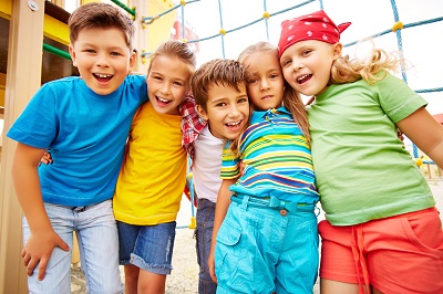 smiling-friends-hugging-in-the-playground.jpg